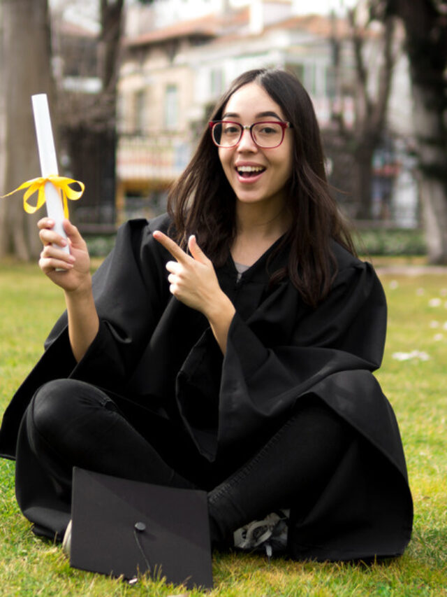 young-woman-graduation-ceremony-pointing-her-diploma (1)